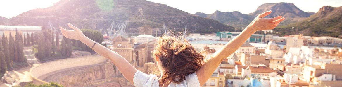 woman with outstretched arms in Cartagena, Murcia