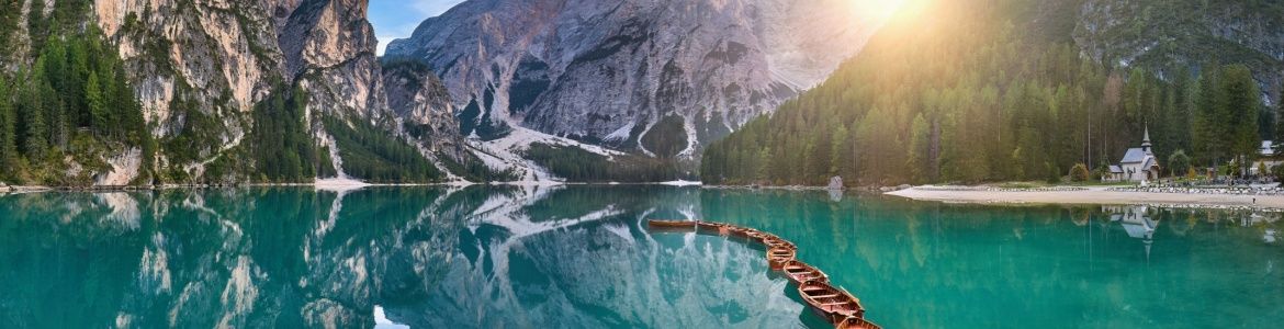 Crystal clear lake surrounded by mountains in di Braies 